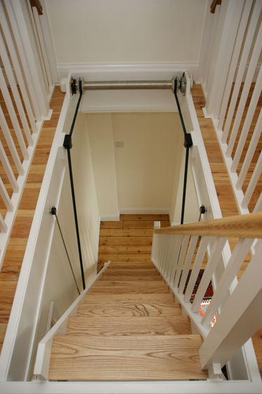 Automatic clearance loft ladder